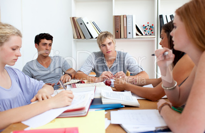 Teenagers studying in the library