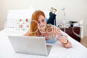 Young girl using a laptop and buying online