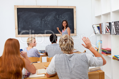 Teenager asking a question in the class