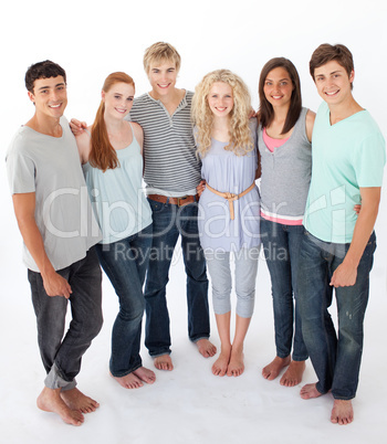 Group of friends standing against white background