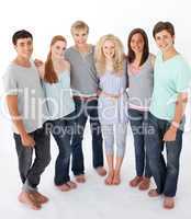 Group of friends standing against white background