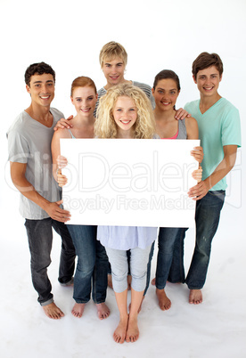 Group of teenagers holding a blank card