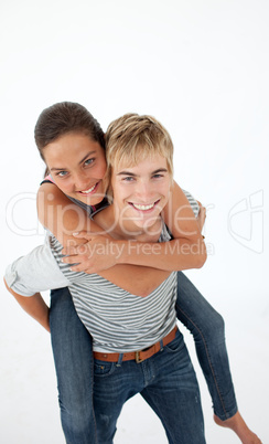 Young boy giving his friend piggyback ride
