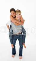 Young boy giving his girlfriend piggyback ride