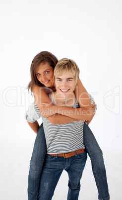 Teen guy giving a friend piggyback ride