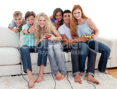 Friends playing video games in the living-room
