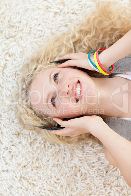 Beautiful teen girl listening to music