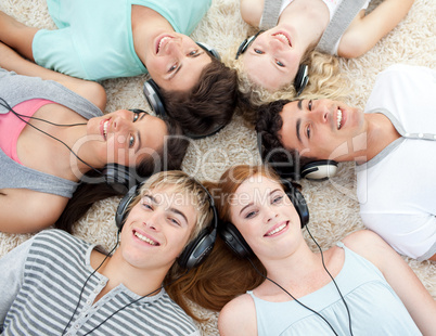 Group of friends listening to music on the floor