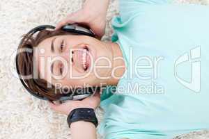 Portrait of teen guy listening to music