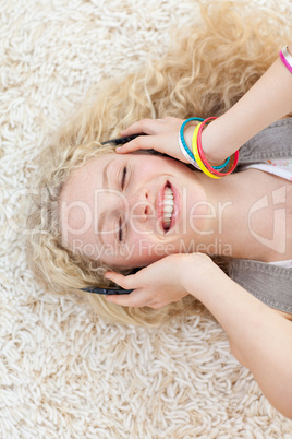 High angle of teen girl listening to music