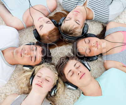 Group of teenagers listening to music