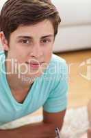 Portrait of a teen guy doing homework