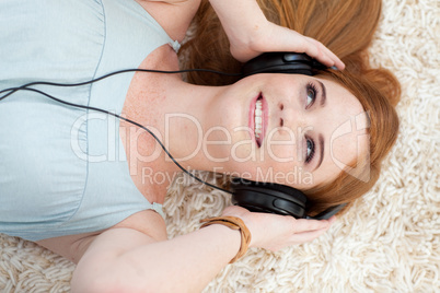 Beautiful teen girl listening to music