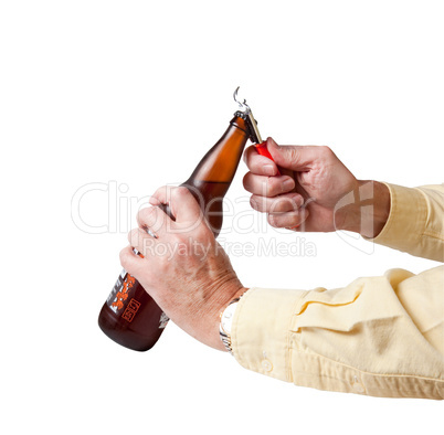 Cap being removed from beer bottle