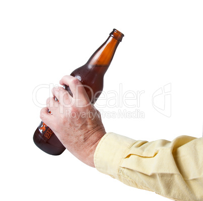 Brown bottle of beer in old hand