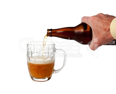 Beer being poured from bottle