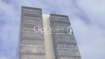 Skyscraper office with  clouds Time lapse