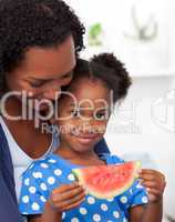 Portrait of a smiling girl eating fruit