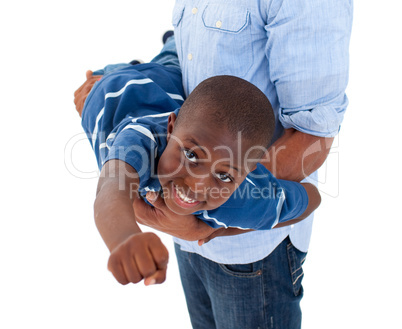 Close-up of a little boy having fun with his father