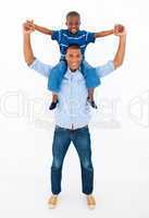 Dad giving son piggyback ride