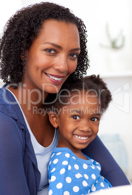 Smiling mother and her little girl