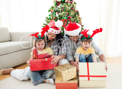 Family decorating a Christmas tree