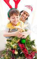 Father and son decorating a Christmas tree