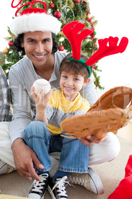 Father and son playing with a Christmas present