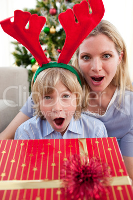 Portrait of a surprised mother and son at Christmas time
