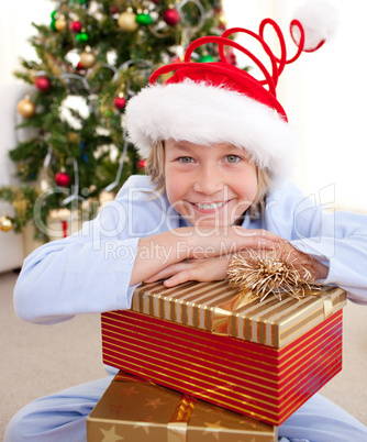 Happy little boy with Christmas presents