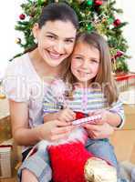 Mother and daughter at home at Christmas time