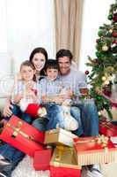 Happy family with lots of Christmas presents
