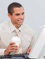 Businessman drinking coffee in the office