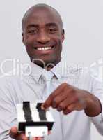 Afro-American businessman looking at an index holder
