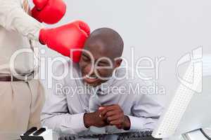 Afro-American businessman being boxed