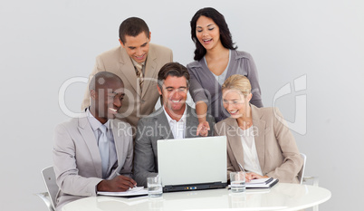 Multi-ethnic business team studying sales figures