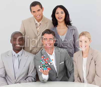 Business team holding molecules in the office