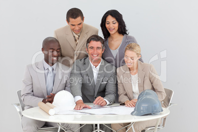 Architectural business people studying plans