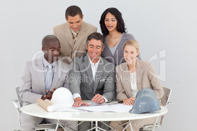 Architectural business people studying plans