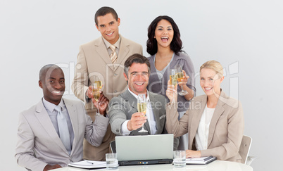 Multi-ethnic business team drinking champagne