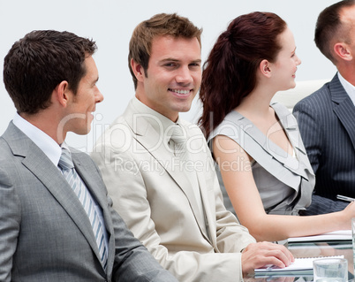 Attractive businessman smiling in a meeting