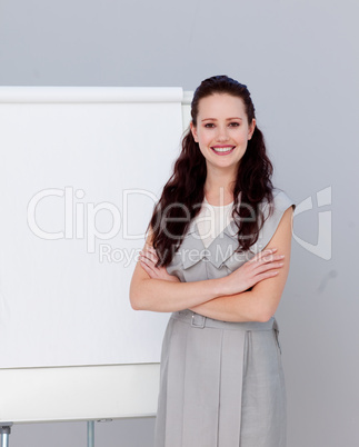 Smiling beautiful businesswoman giving a presentation
