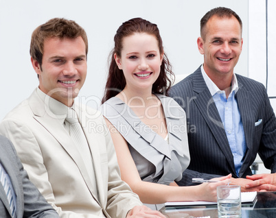 Portrait of business people sitting in a meeting