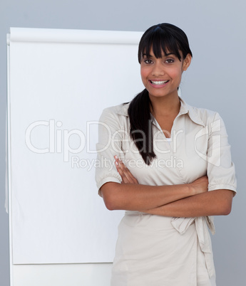 Smiling Afro-American businesswoman giving a presentation