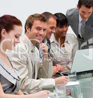 Young businessman working with his team