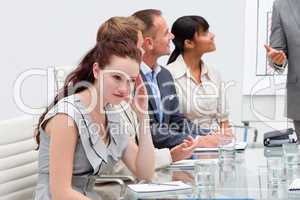 Businesswoman getting tired in a meeting