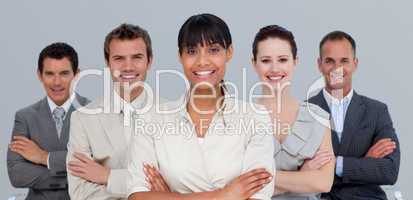 Smiling multi-ethnic business team with folded arms