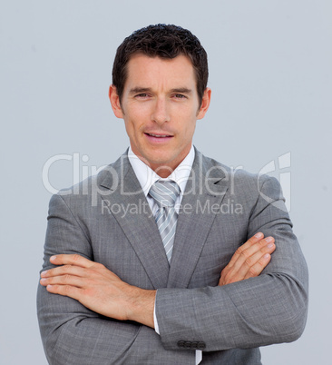 Portrait of smiling businessman with folded arms