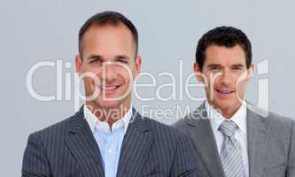 Portrait of smiling businessmen with folded arms
