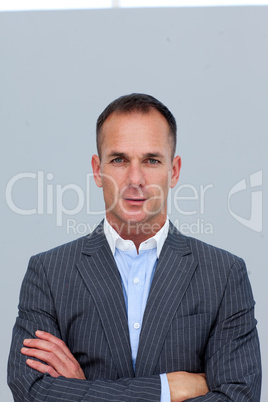 Portrait of confident businessman with folded arms